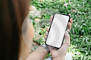 mockup image cell phone blank white screen for text. woman hand holding texting message chatting with friend
