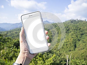 Mockup image of a hand holding and showing white smart phone with blank desktop screen