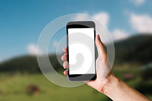 Mockup image of hand holding white mobile phone with blank white.