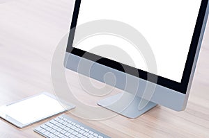 Mockup image of hands holding black tablet pc with blank white desktop screen while sitting in cafe