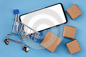 Mockup image of smartphone with the blank white screen with a place for the advertised text in shopping cart and cardboard boxes