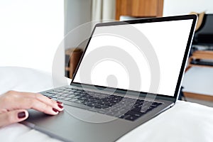 Mockup image of woman`s hands using and touching on laptop