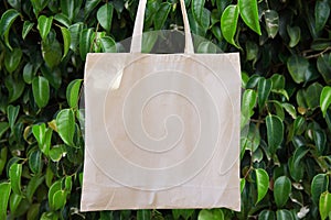 Mockup Linen Cotton Tote Bag on Green Forest Trees Foliage Background. Eco Nature Friendly. Environmental Conservation Recycling