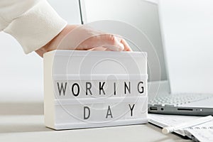 Mockup or mock-up. Workplace with a laptop, hands of a man, notepad on a white background. Freelancer& x27;s workplace