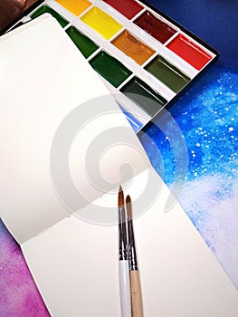 Mockup notebook paper watercolor paint palette paintbrush space photo