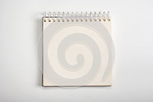 mockup notebook. Spiral notebook from top view with empty white space, square notepad with blank sheet