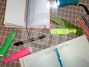 Mockup notepad, diary with pen, pencil, ruler, markers and a flashlight