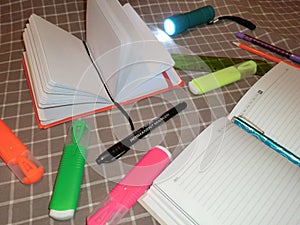 Mockup notepad, diary with pen, pencil, ruler, markers and a flashlight