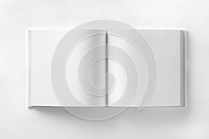 Mockup of opened blank square ctalogue at white design paper background.