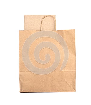 Mockup paper shopping bag with cardboard box isolated on white background.