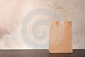 Mockup of paper shopping bag on table