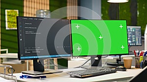 Mockup PC in empty IT startup office displaying programming languages