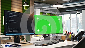 Mockup PC in empty IT startup office displaying programming languages