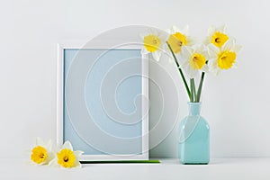 Mockup of picture frame decorated daffodil flowers in vase with clean space for text your blogging and greeting for mother day.