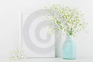 Mockup of picture frame decorated flowers in vase on white background with clean space for text and design your blogging.