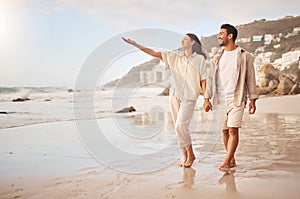 Mockup, pointing and a couple holding hands on the beach while walking together on a date for romance. Love, happy or