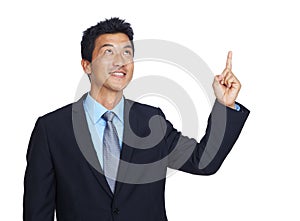 Mockup, pointing and idea with a business asian man in studio isolated on a white background for growth. Marketing