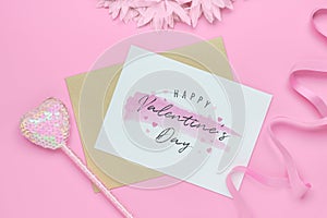 Mockup postcard and envelope on pink background with Happy valentines day, handy craft and pen. Mock up for elegant design. Flat