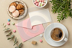 Mockup with postcard, sweets, and coffee cup