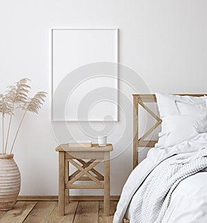 Mockup poster frame in white cozy bedroom interior, Scandinavian style