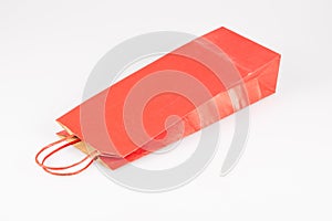 Mockup red paper shopping bootle bag on white background