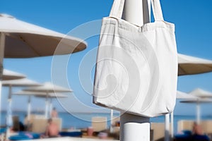 Mockup shopper handbag hanging on the beach