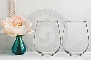 Mockup - stemless wine glasses, peony in a vase