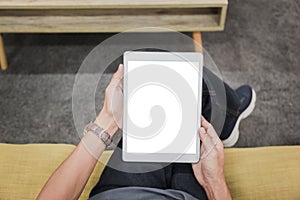 Mockup tablet on businessman hands empty display on home table with blur background. - Image - Image