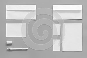 Mockup template for branding identity. White stationery on grey background top view copy space. Pattern