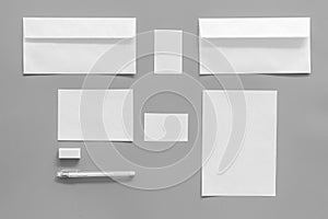 Mockup template for branding identity. White stationery on grey background top view. Pattern