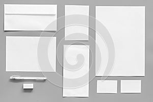 Mockup template for branding identity. White stationery on grey background top view. Pattern