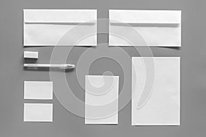 Mockup template for branding identity. White stationery on grey background top view. Pattern