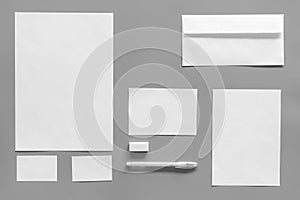 Mockup template for branding identity. White stationery on grey background top view. Pattern