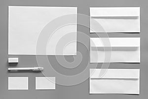 Mockup template for branding identity. White stationery on grey background top view. Pattern