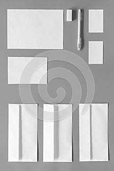 Mockup template for branding identity. White stationery on grey background top view. Pattern