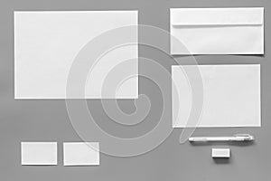 Mockup template for branding identity. White stationery on grey background top view. Pattern