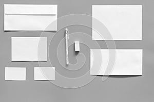 Mockup template for branding identity. White stationery on grey background top view. Pattern