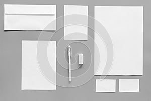 Mockup template for branding identity. White stationery on grey background top view. Pattern