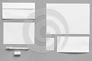 Mockup template for branding identity. White stationery on grey background top view. Pattern