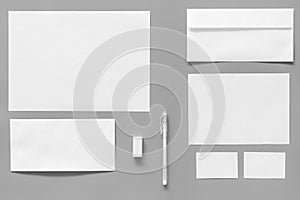 Mockup template for branding identity. White stationery on grey background top view. Pattern