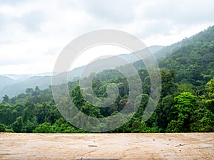 Mockup template of empty old wooden top table on green mountain view and sky background.