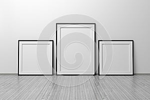 Mockup template of two vertical A4 frame with thin black frame standing next to wall on wooden floor