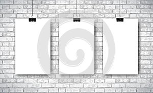 Mockup with three empty white posters on white brick wall background. Trendy portfolio blanc space frame background. Vector