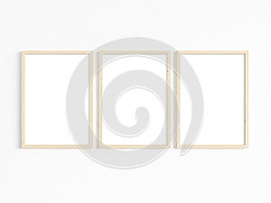 A mockup of three thin A4 wooden frames with portrait orientation. 3D illustration