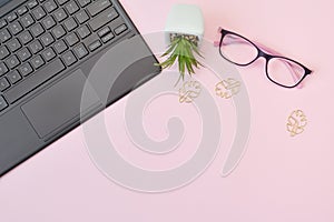 Mockup top view Online home education. Home School with glasses and laptop with place for text on pink background. Remote work and
