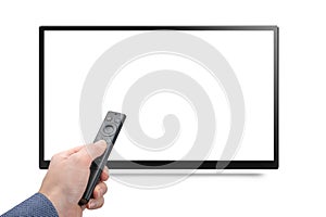 Mockup tv and hand with modern remote control from an online media box isolated on white background. TV 4K 8K flat screen lcd or