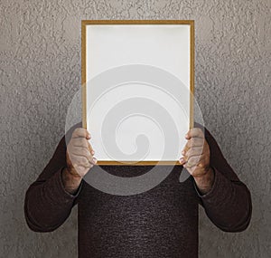 mockup. unrecognizable 2 mens holding behind head white blank picture photo frame. mock up template. two males holding image frame