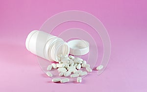 Mockup vitamin complex from beriberi jar and capsules granules tablets pink background