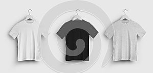 Mockup of white, black, heather t-shirt, children\'s clothes on hanger, front, isolated on background