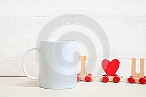 Mockup of a white ceramic mug on a table